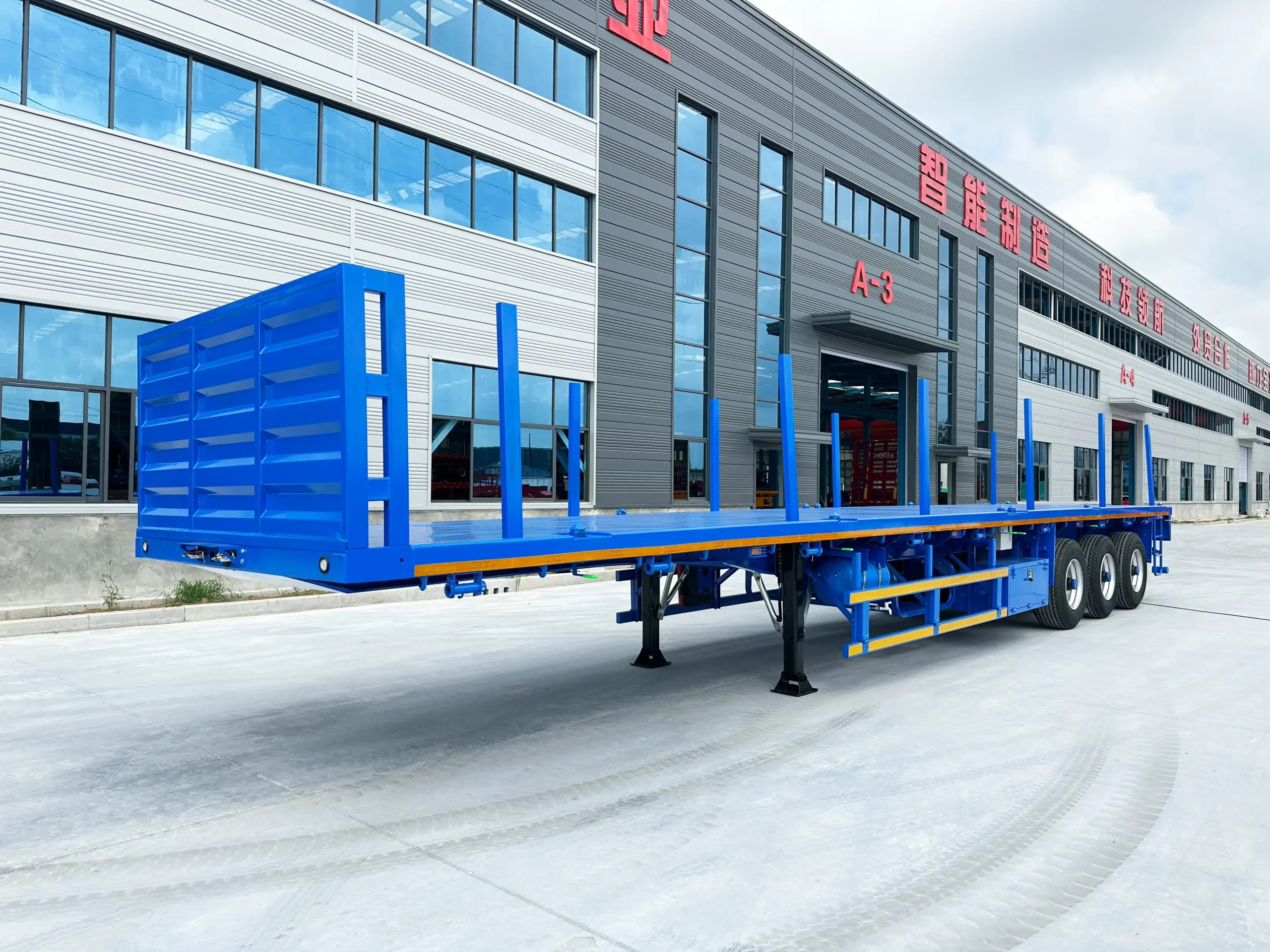 Open flatbed deck with side stakes and container-lock positions