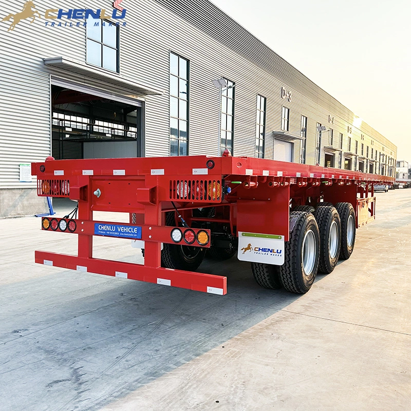 Side view of a flatbed trailer with stakes