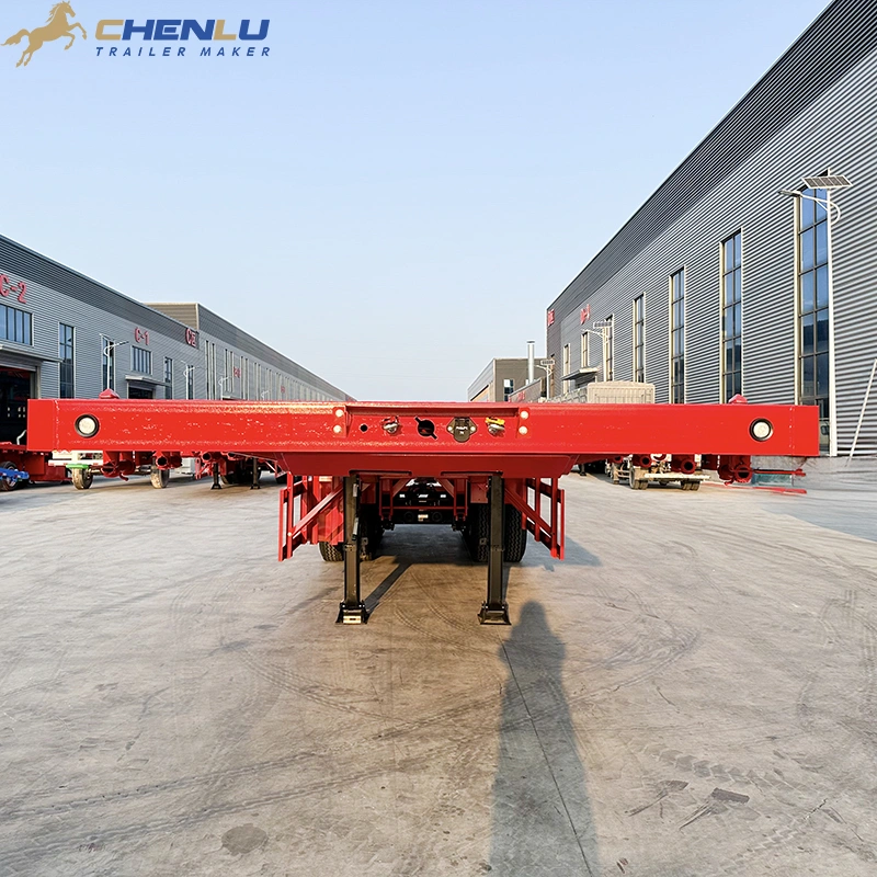 Red 3 axle flatbed semi trailer with upright side stakes