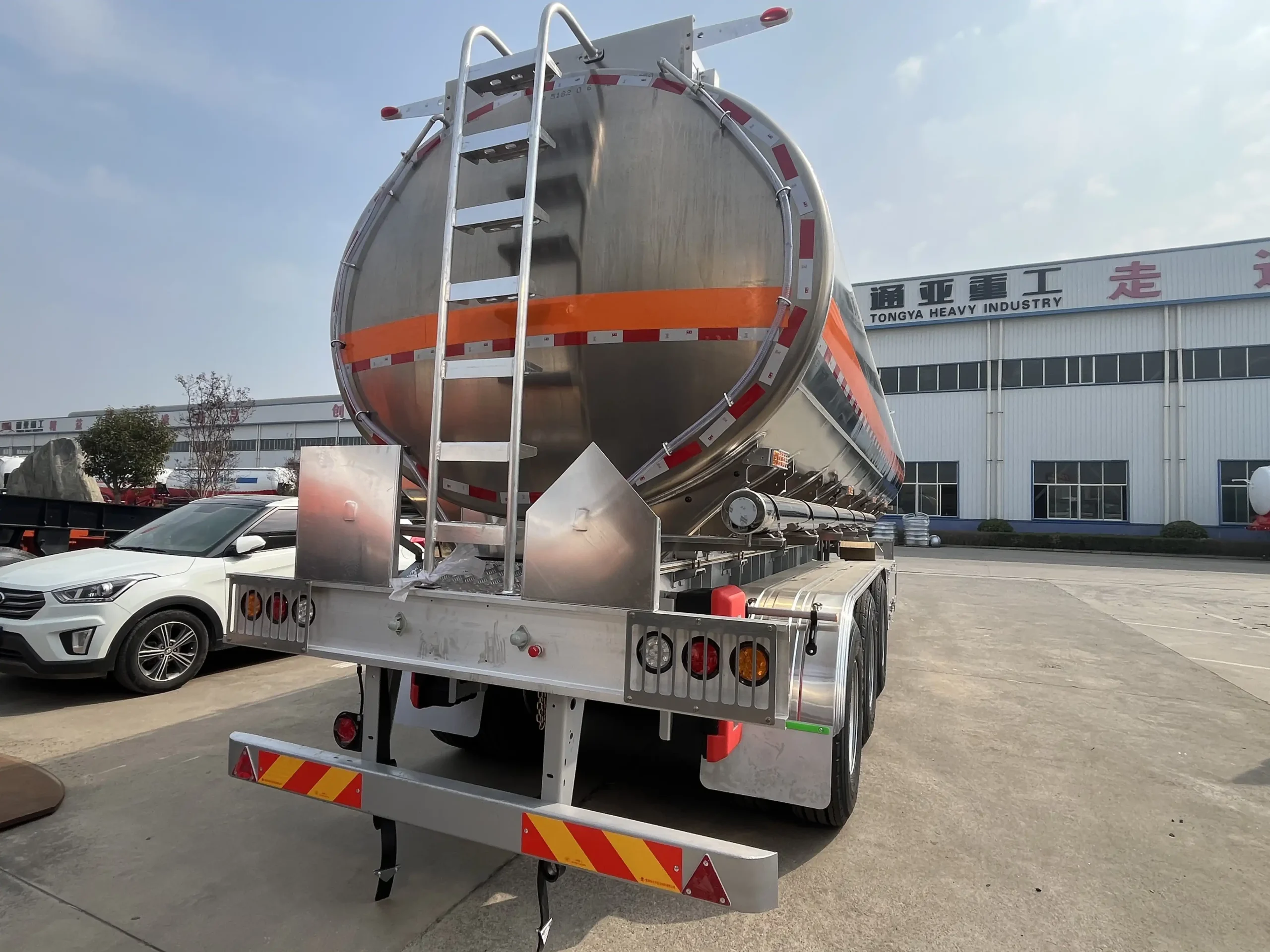 Rear view of a CHENLU aluminium fuel tanker showing the access ladder and external equipment