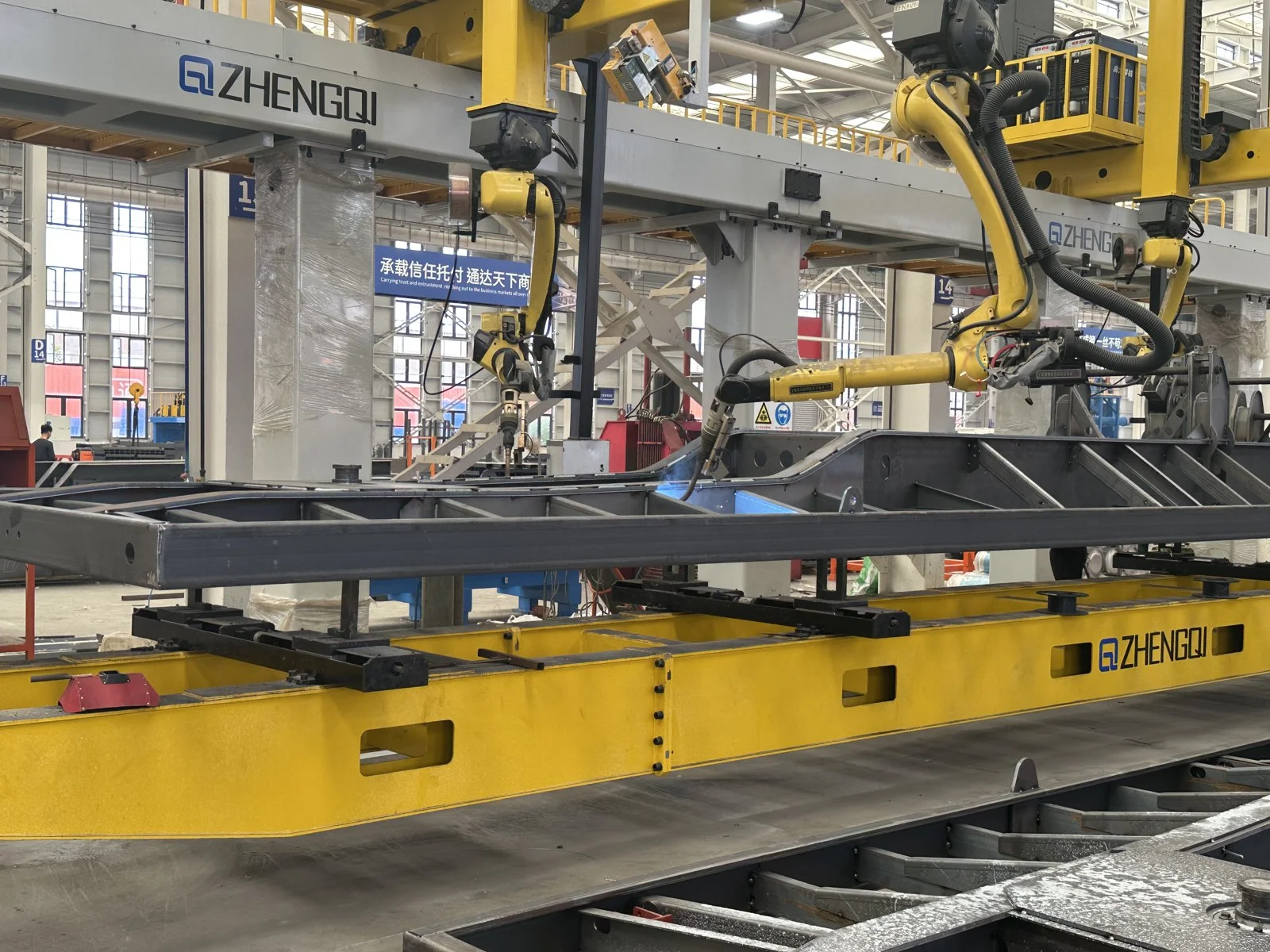Automated welding equipment working on a semi-trailer frame at CHENLU