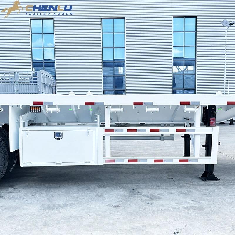 Side view of a white 12.5m flatbed semi trailer