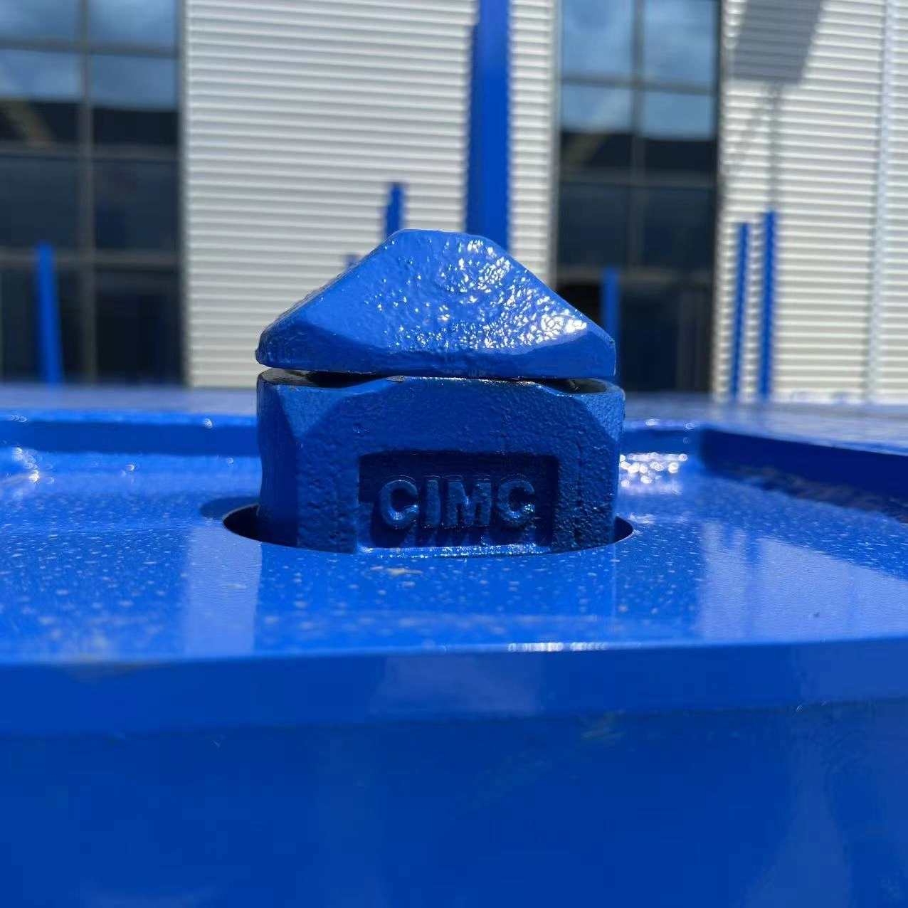 Close-up of a container twist lock fitted to the flatbed deck