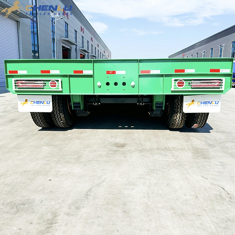 Rear view of the custom green trailer showing the tail section and lights