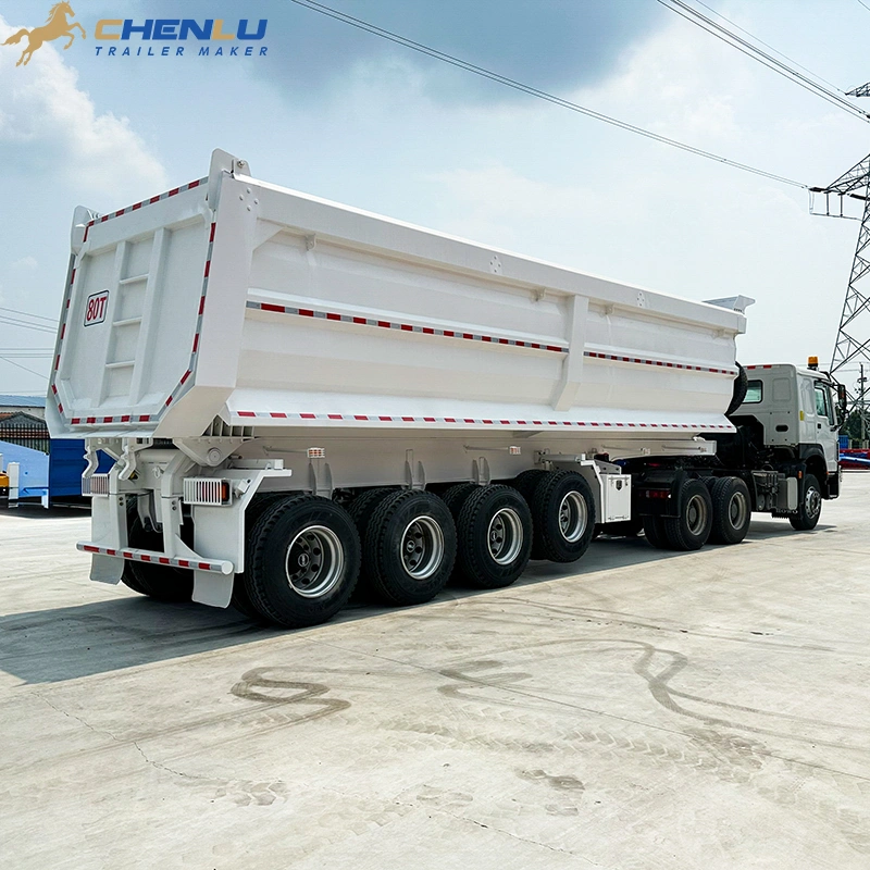 Four visible axle positions on rear dump semi trailer