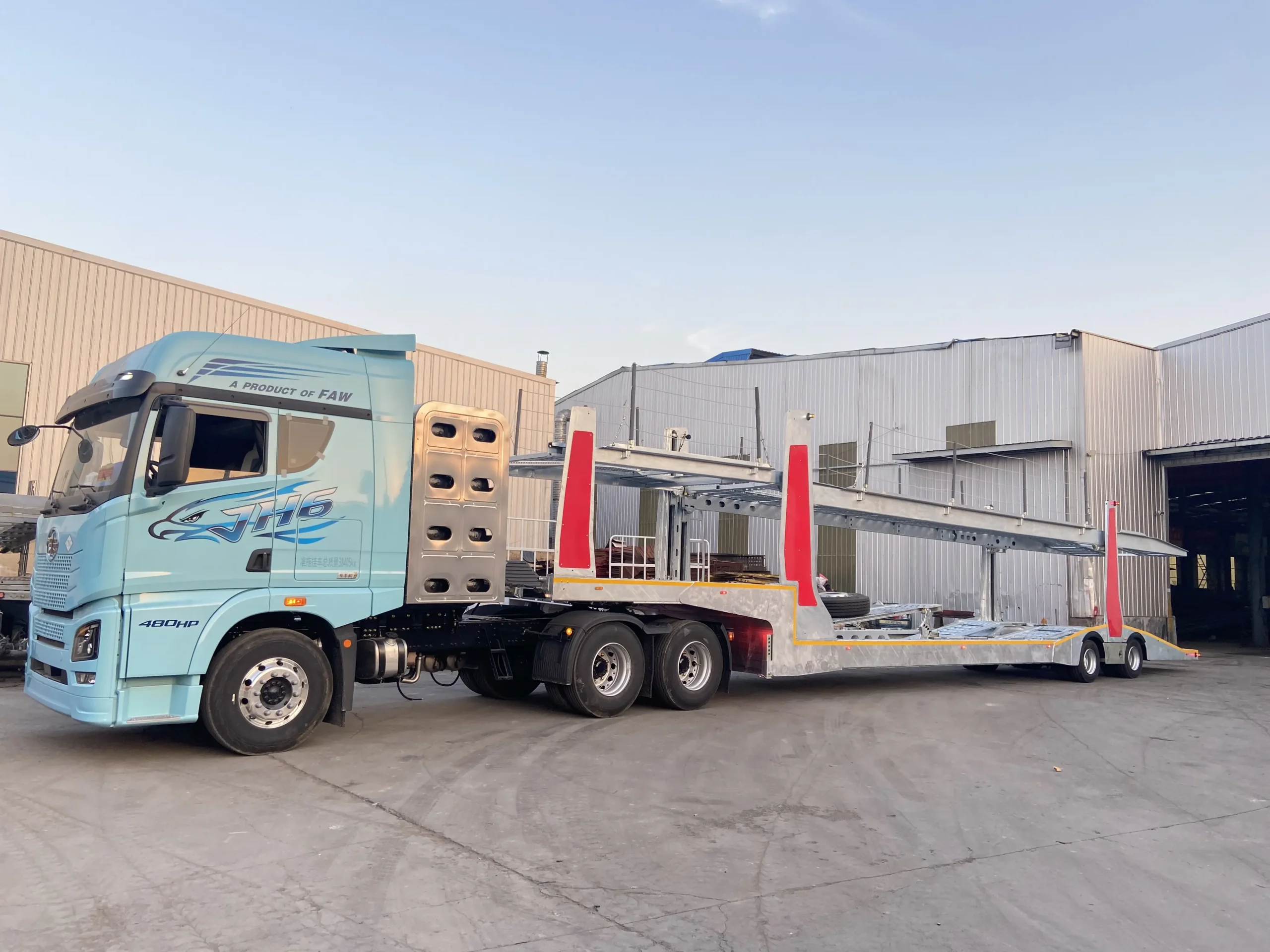 Empty galvanized auto transport semi trailer at factory