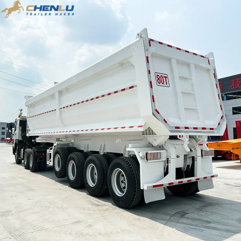 Rear view of a white dump semi-trailer in the factory yard