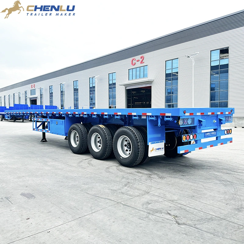 Blue 60 ton 3 axle flatbed semi trailer for heavy cargo transport