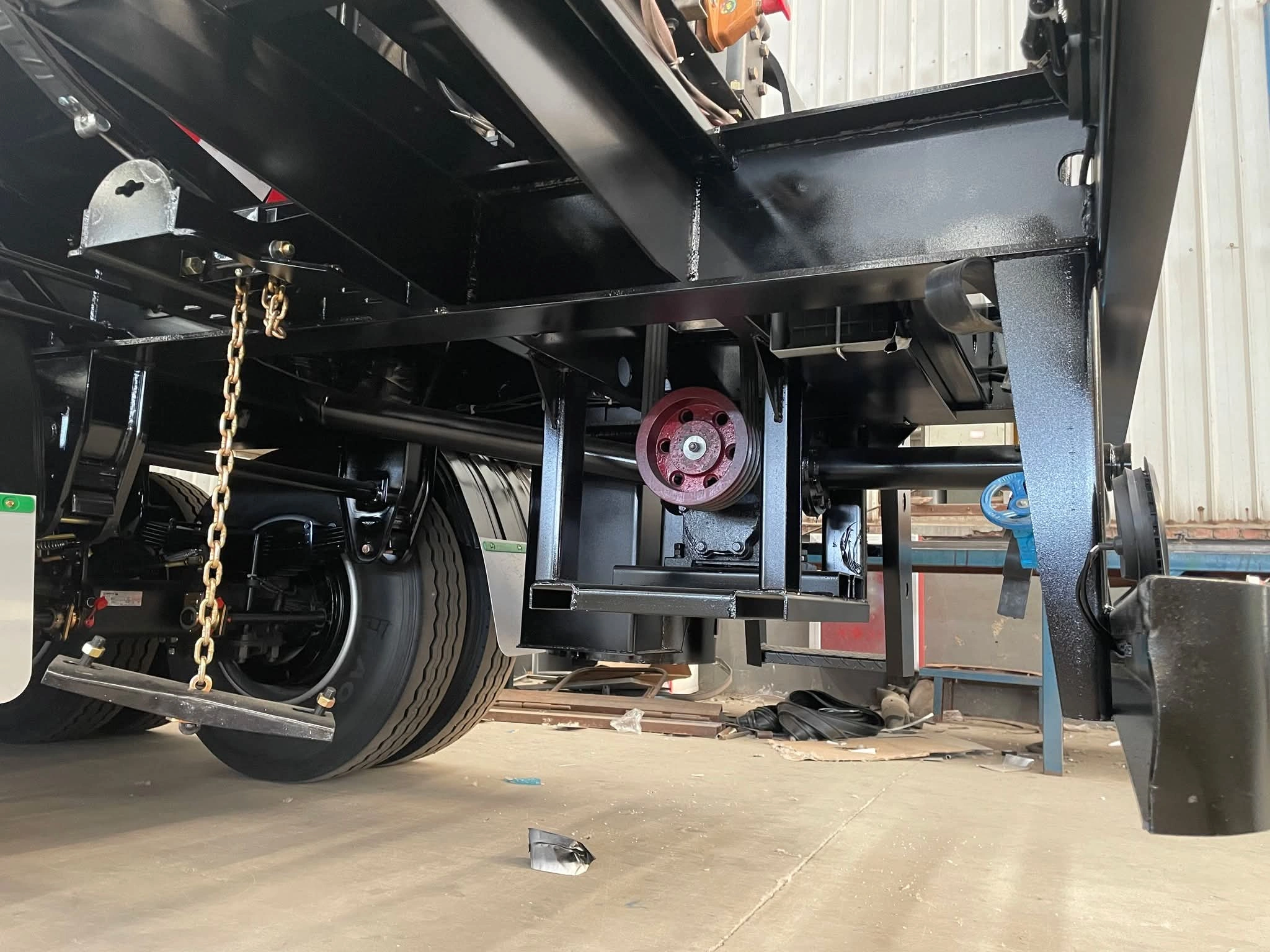 Rear-quarter view of three-axle asphalt tanker