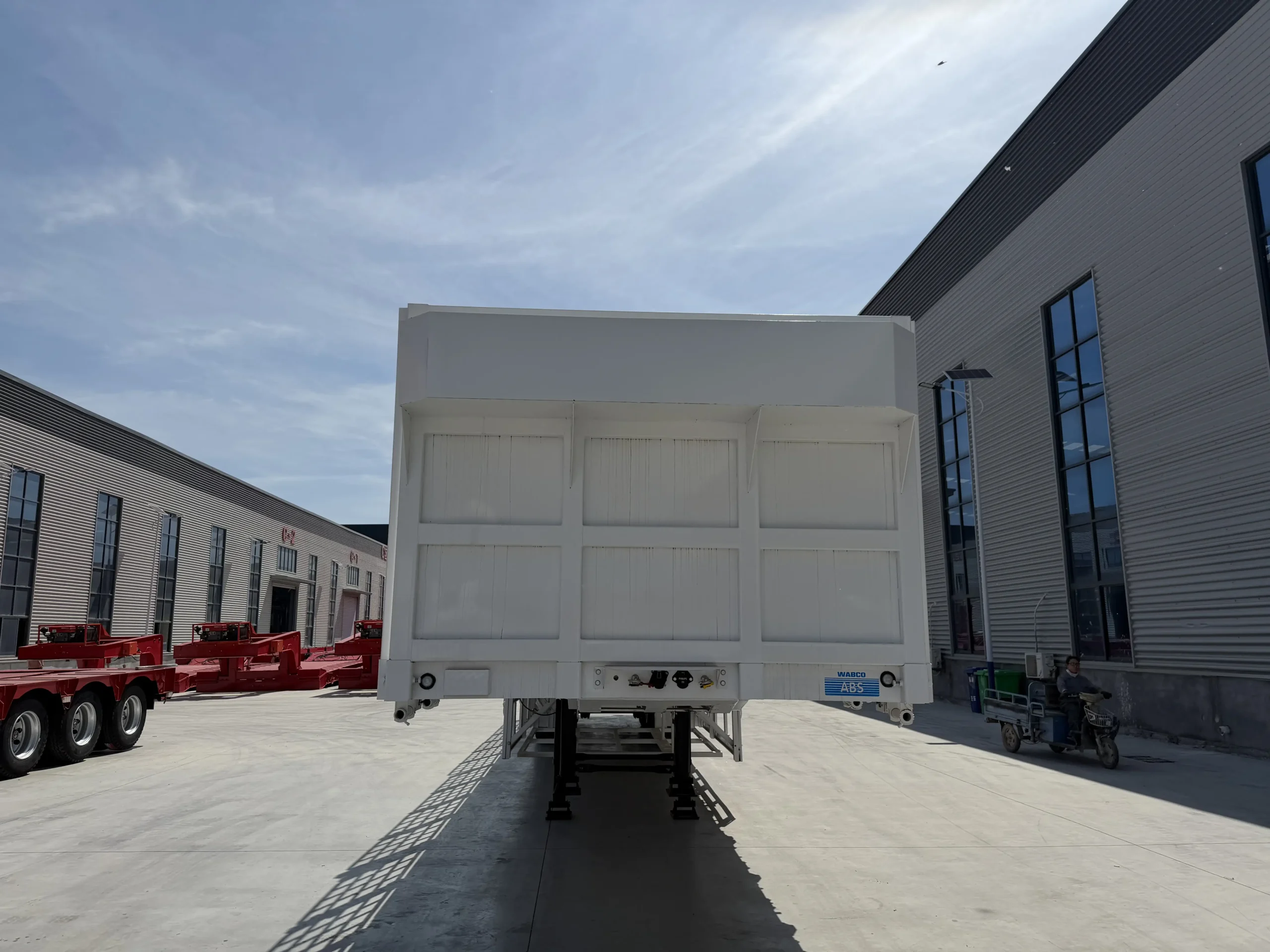 Rear view of the three-axle fence cargo semi trailer
