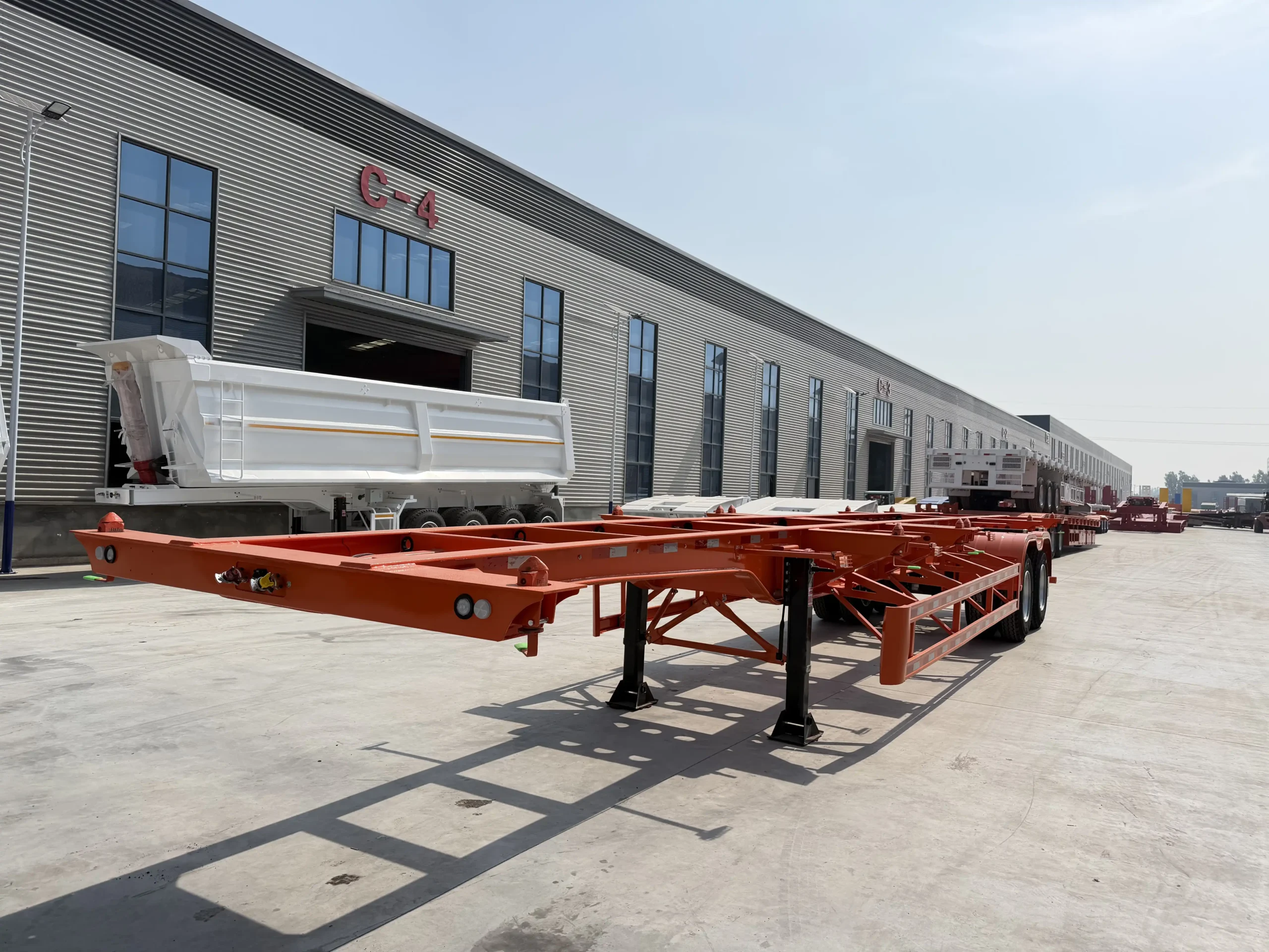 Orange 12.5m 2 axle 40ft skeleton semi trailer with container twist locks