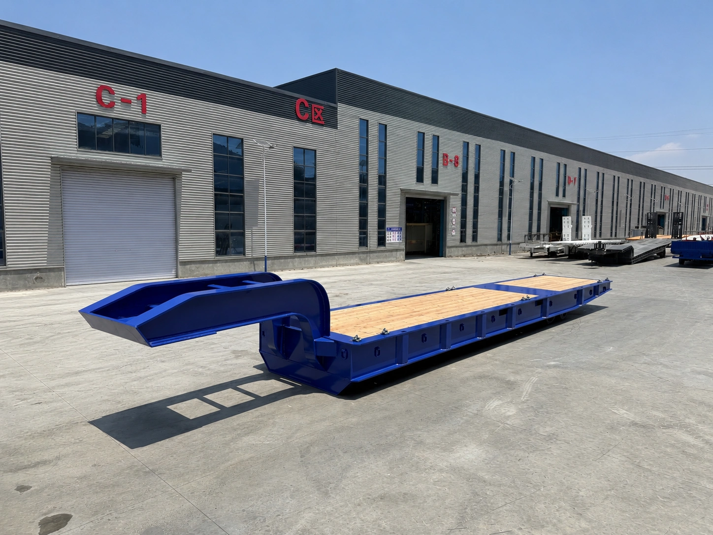 Blue two-axle hydraulic folding gooseneck lowbed trailer