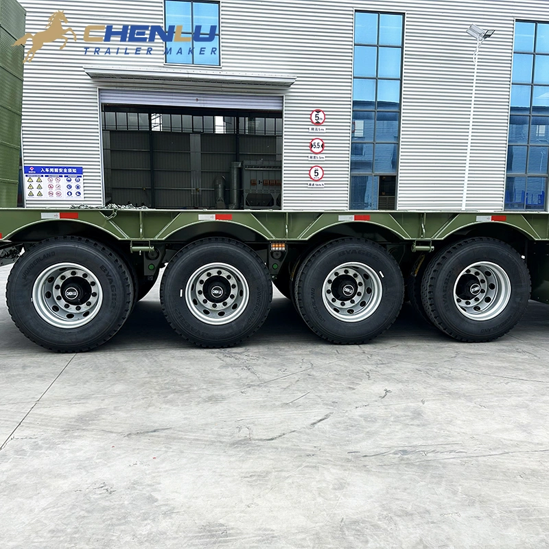 Four axle running gear on a custom army green lowbed trailer