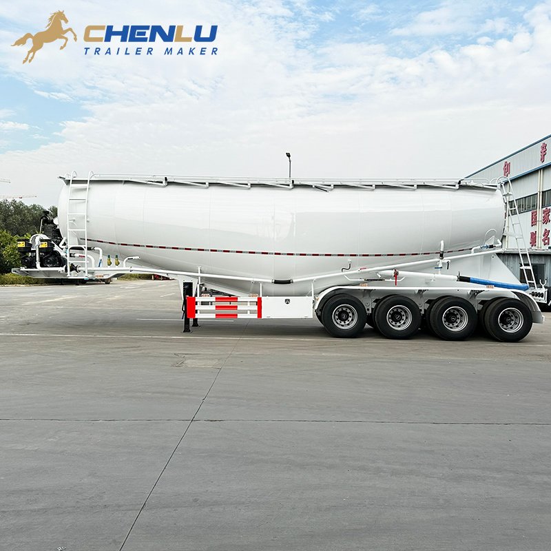 Side discharge pipe, hand-operated valves and hose on a four-axle cement tanker