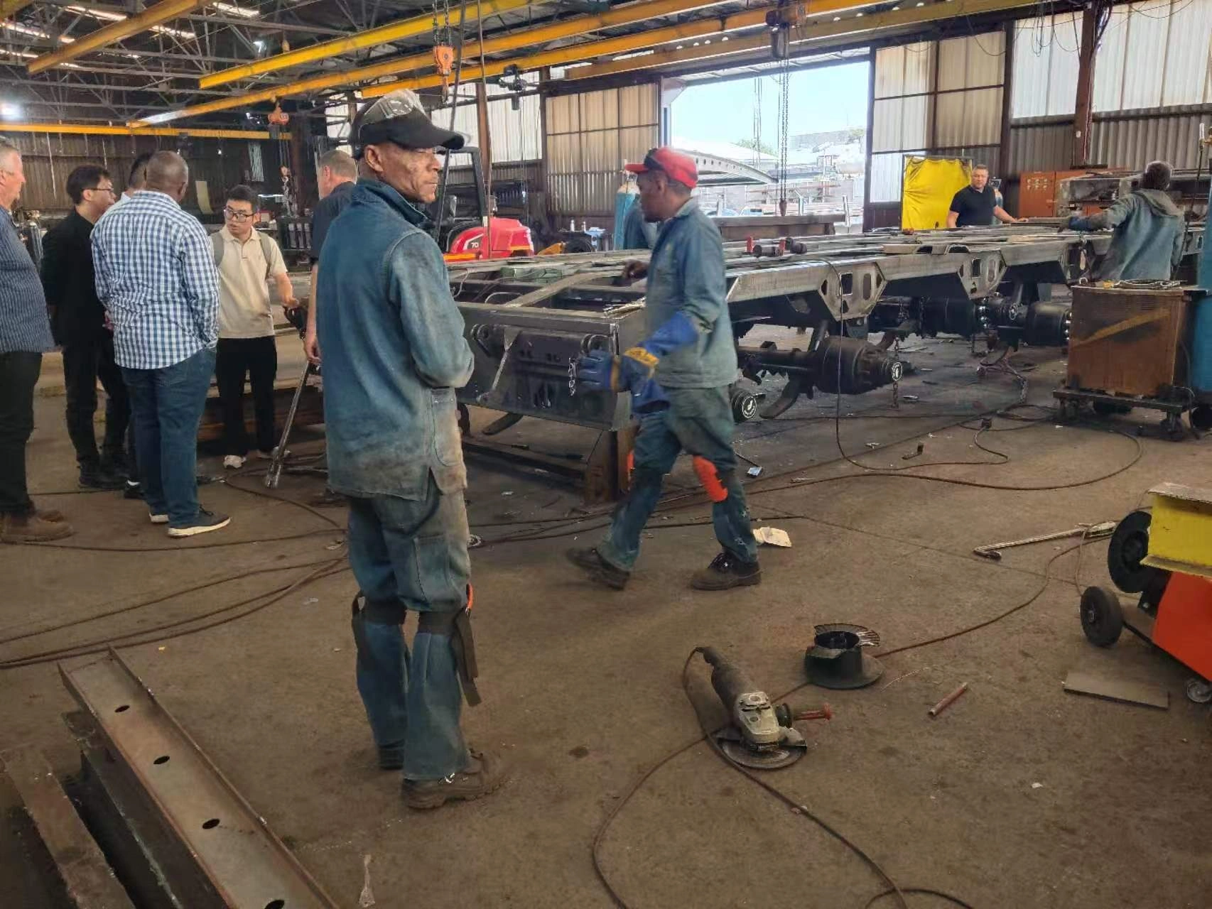 Hydraulic lifting assembly reviewed during an East African trailer factory visit
