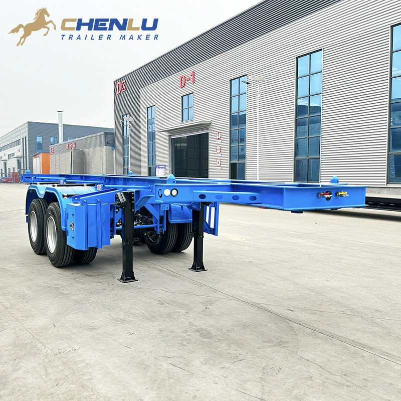 Front corner view of the blue skeleton trailer with its landing gear lowered
