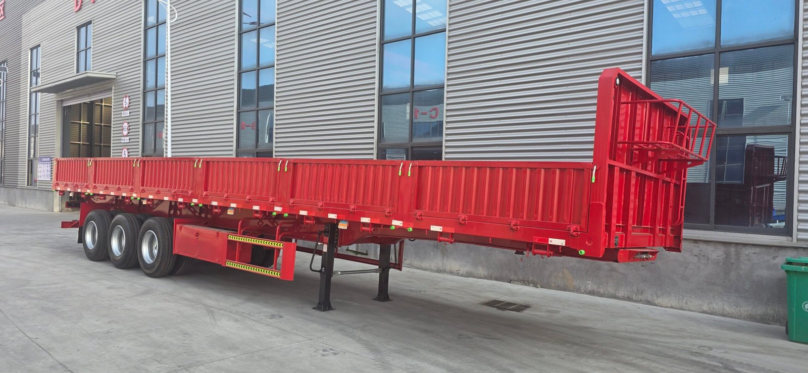 Red 60-tonne three-axle side-tipping semi-trailer built for Ghana