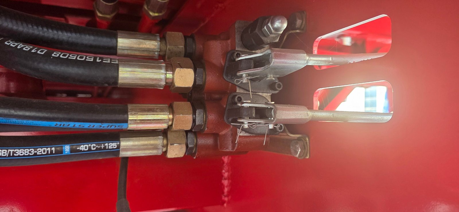 Hydraulic control levers on the Ghana side-tipping semi-trailer