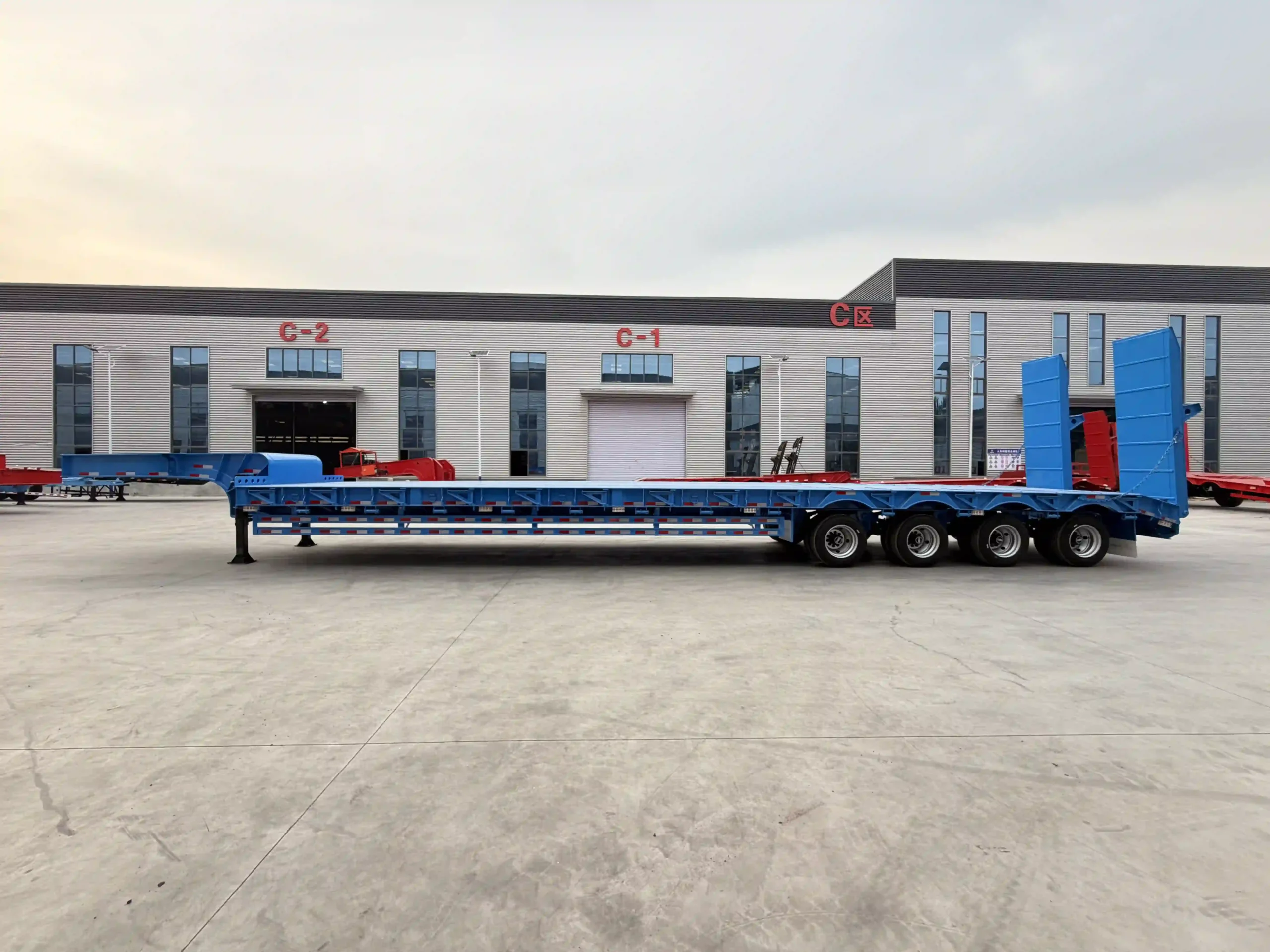 Blue 80 ton four axle fixed gooseneck lowbed trailer side view