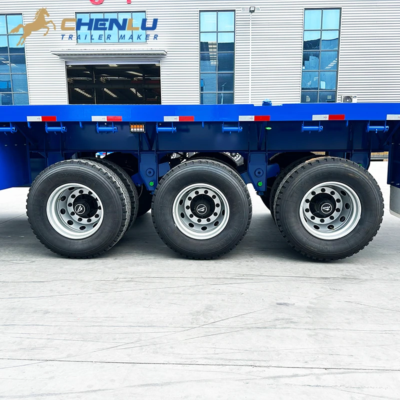 Three-axle wheel group beneath the flatbed trailer