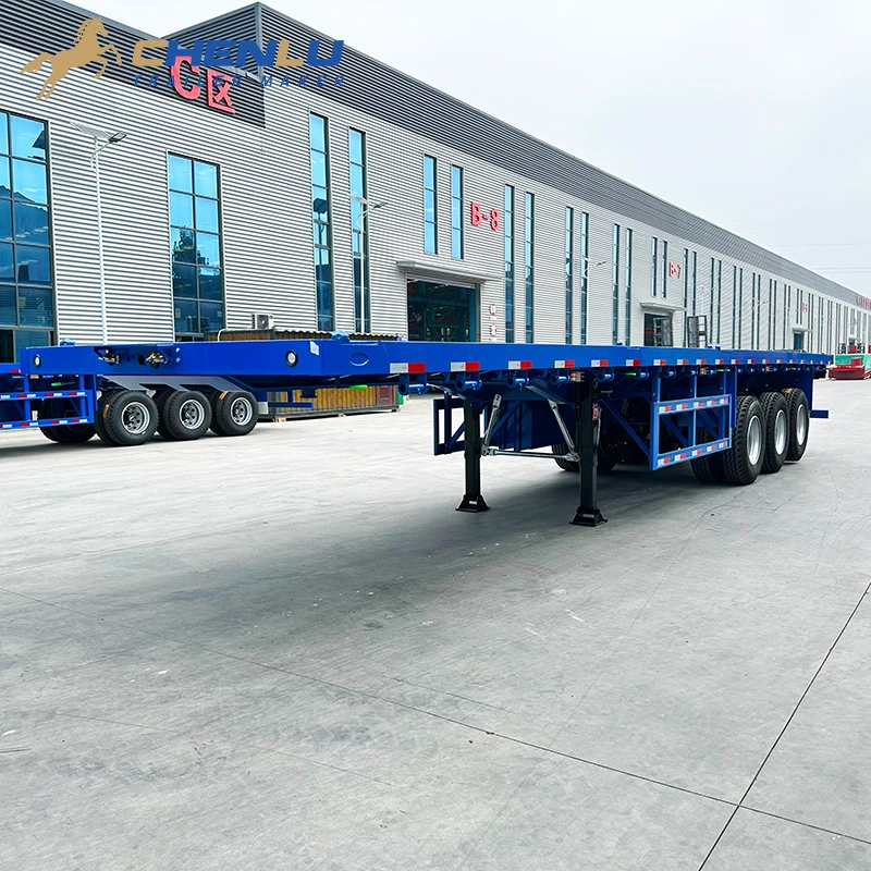 Open platform on the blue three-axle flatbed trailer