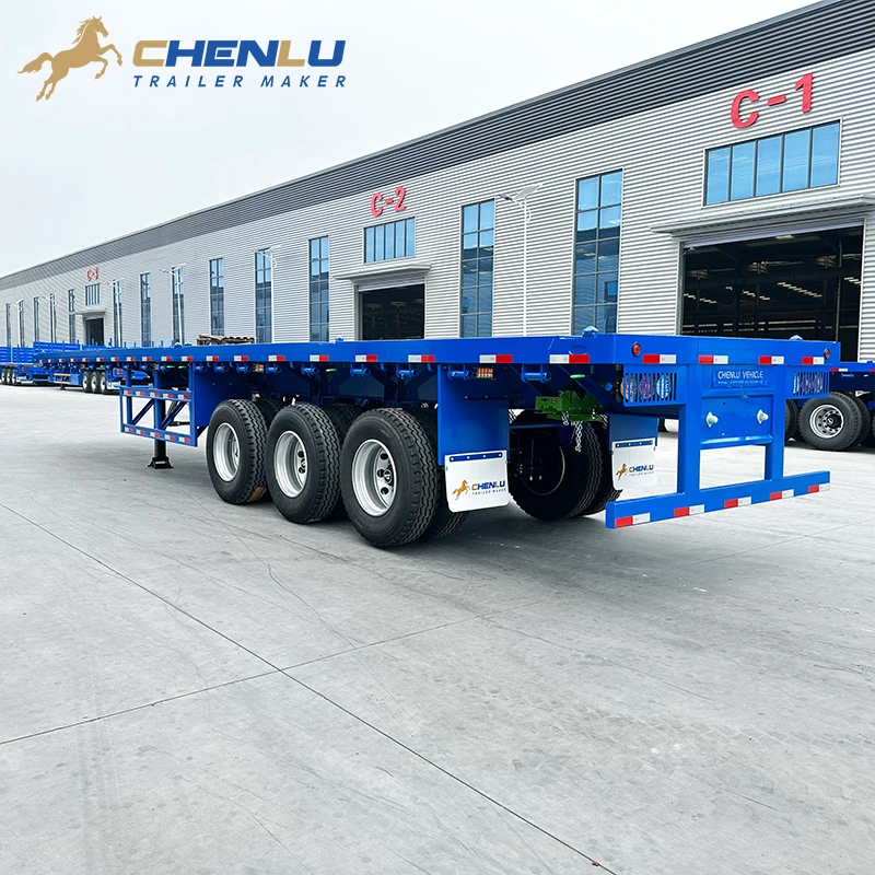 Rear three-quarter view of the blue flatbed semi trailer