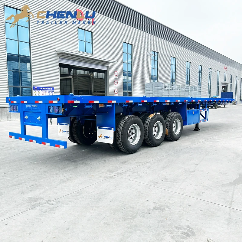 Rear three-quarter view of the blue 40 ft three-axle flatbed semi-trailer