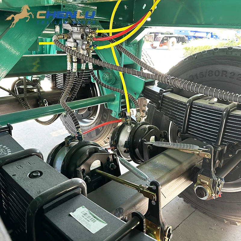 Brake chambers and air lines around the fuel tanker trailer suspension