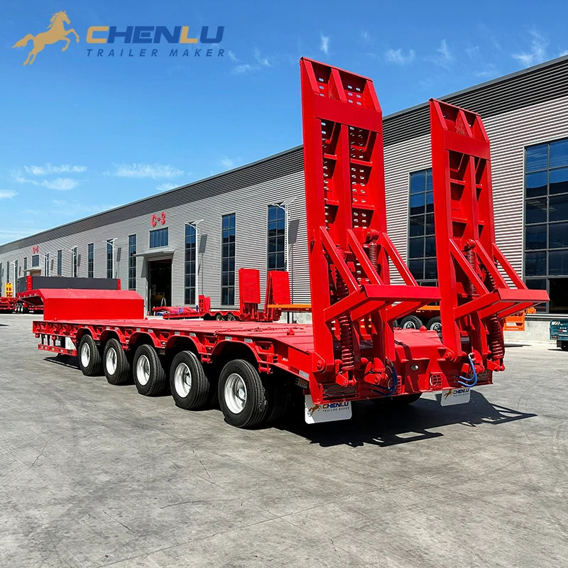Rear view of the five-axle lowbed trailer and its two loading ramps