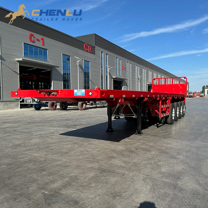 Red four-axle flatbed semi trailer outside the CHENLU factory