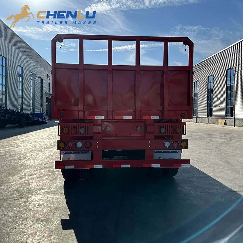 Fixed end wall on the red four-axle flatbed trailer