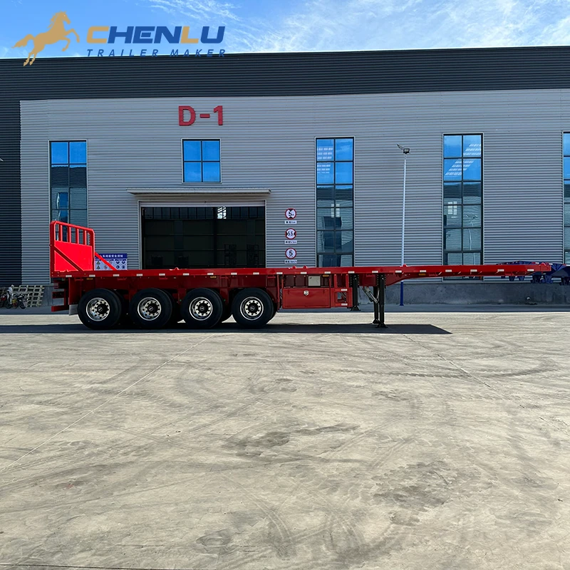 Side profile of the red flatbed trailer with four axles and a fixed end wall