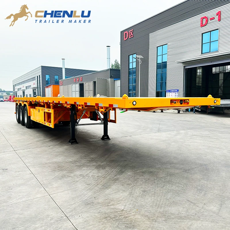 Yellow 60 ton 3 axle flatbed semi trailer outside the CHENLU workshop