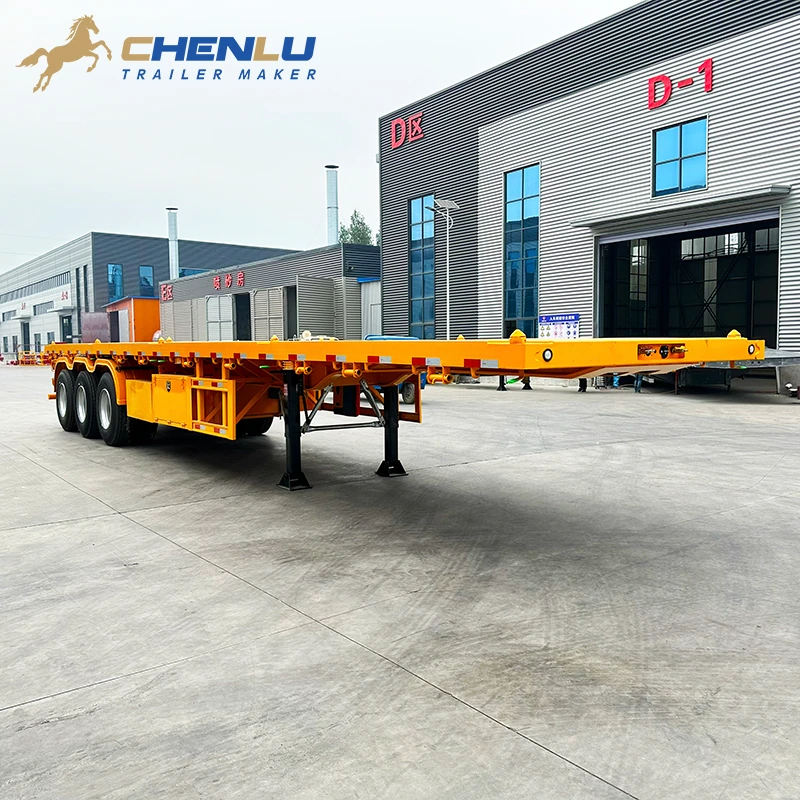 Open steel deck on the yellow 60 ton flatbed semi trailer