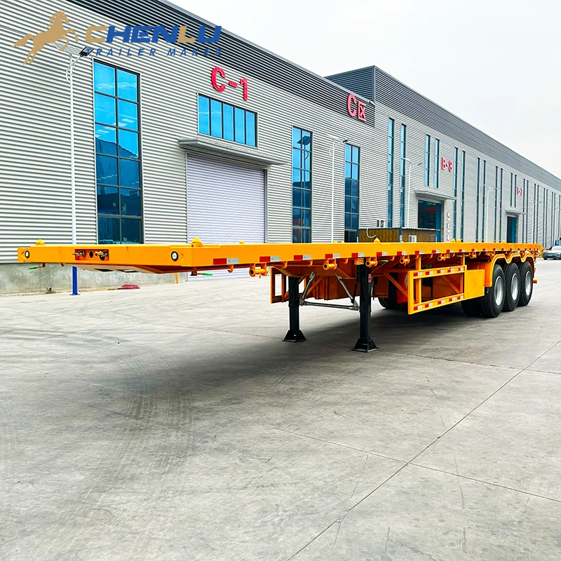 Yellow 60 ton three-axle flatbed semi trailer with open loading platform