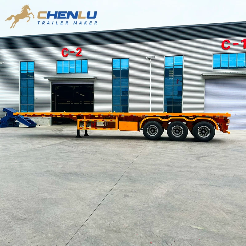 Side view of the yellow 60 ton 3 axle flatbed semi trailer
