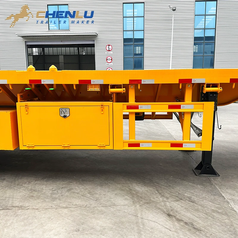 Toolbox side guard and landing leg beneath the flatbed deck
