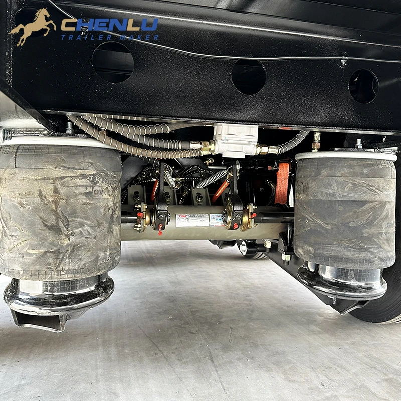 Air suspension detail beneath the five-axle curtain side trailer