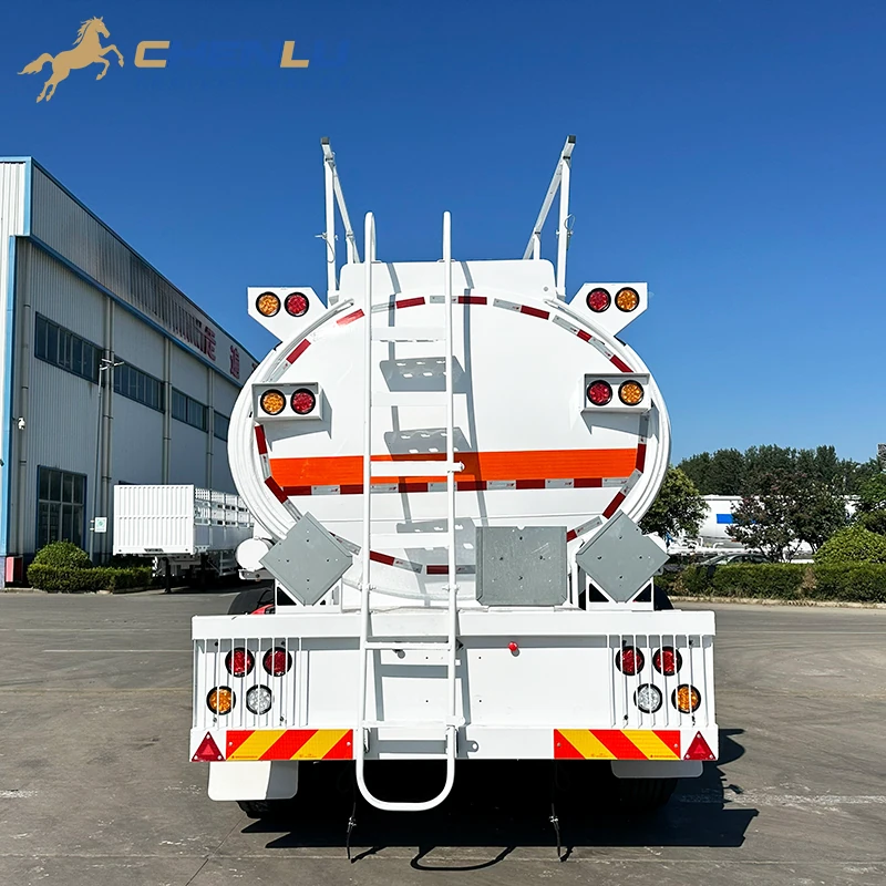 Rear equipment on the white 9,000 litre fuel tanker trailer, including ladder, lamps and reflective markings